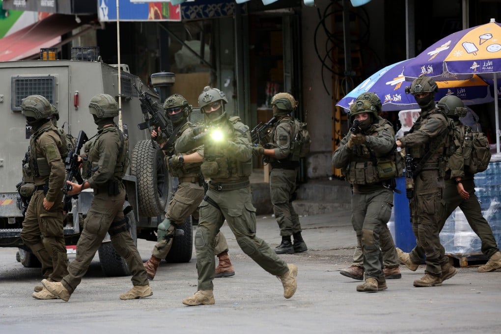 Israeli soldiers during clashes with Palestinian protesters following an Israeli military raid in the West Bank city of Nablus. Photo: Xinhua
