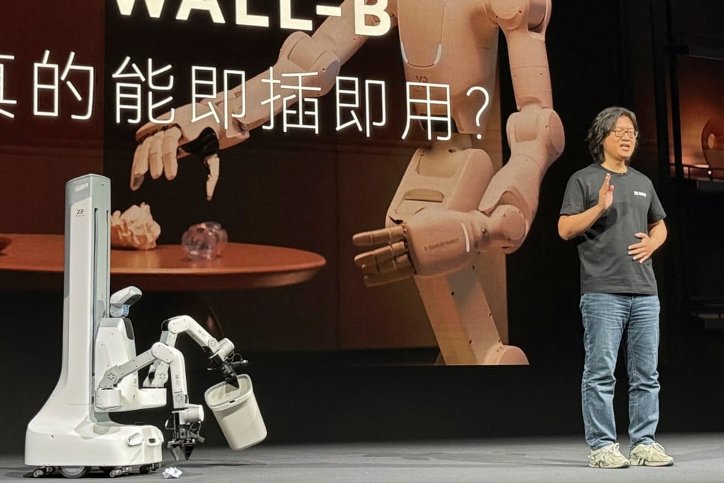 X Square Robot CEO Wang Qian shows a robot that capable of picking up rubbish in Beijing on April 21. Photo: Reuters