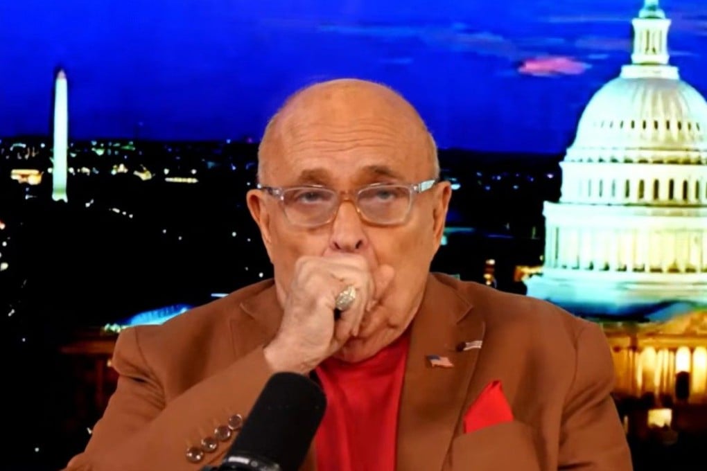 Rudy Giuliani coughs during his 'America’s Mayor Live' broadcast on Friday. Photo: @RudyWGiuliani via YouTube
