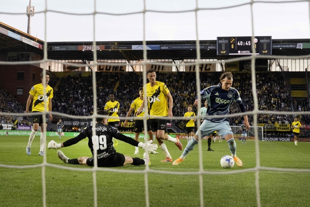 Mika Godts (right) scores Ajax’s second goal in their 2-0 win last month over NAC Breda, who sit second from bottom of the Eredivisie. Photo: AFP