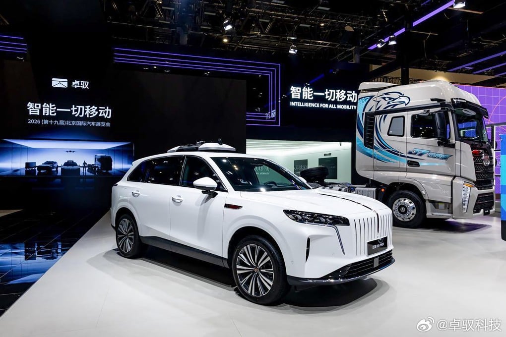 Vehicles are displayed in ZYT’s booth at the Beijing Auto Show. Photo: Weibo