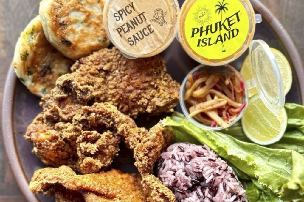 Fried chicken with mommy cakes and sticky rice lettuce wraps at Mommy Pai’s, one of the many restaurants in the US that are looking beyond the classics to put unique twists on Thai dishes.