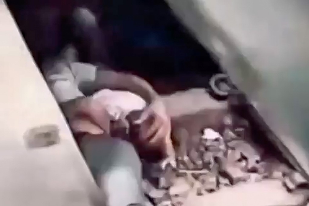 A Bangladeshi man jumped onto the train tracks to shield his baby with his body, sparking both praise and debate about his actions. Photo: Handout