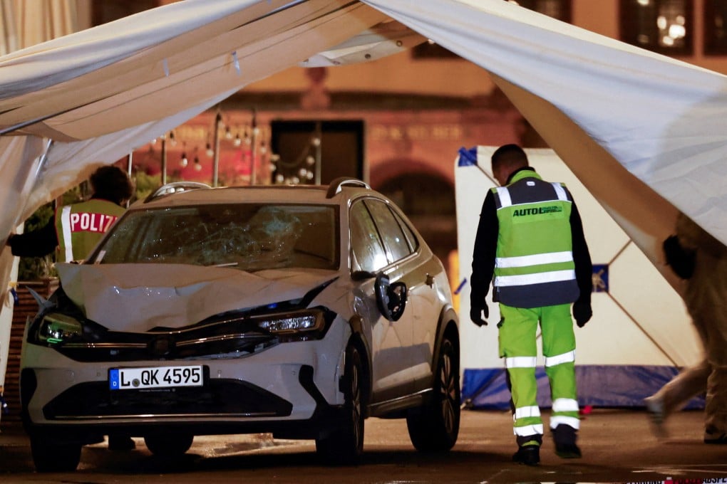 Photos from the scene show a car with a battered front and a shattered windshield. Photo: Reuters