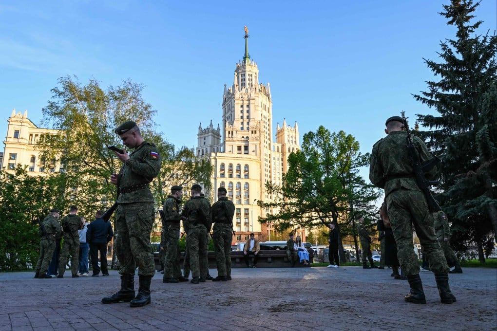 Russian soldiers stand on the sidelines of the rehearsal of the Victory Day military parade, to be held at Red Square, in central Moscow on Monday. Photo: AFP
