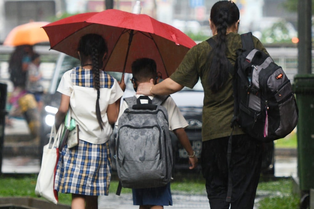 Students leave school after class in Singapore. Photo: Xinhua