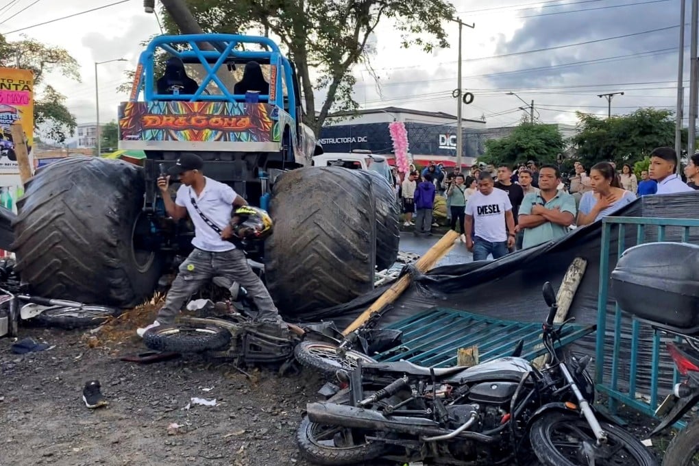 People stand near a monster truck after a driver lost control of the vehicle and ploughed into spectators in Popayan, Cauca province, Colombia on Sunday. Photo: taken with a mobile phone / Reuters