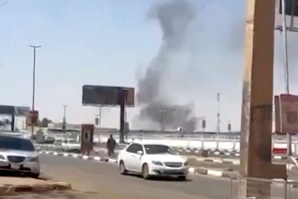 Smoke rises following a drone attack targeting Khartoum airport. Photo: Reuters TV