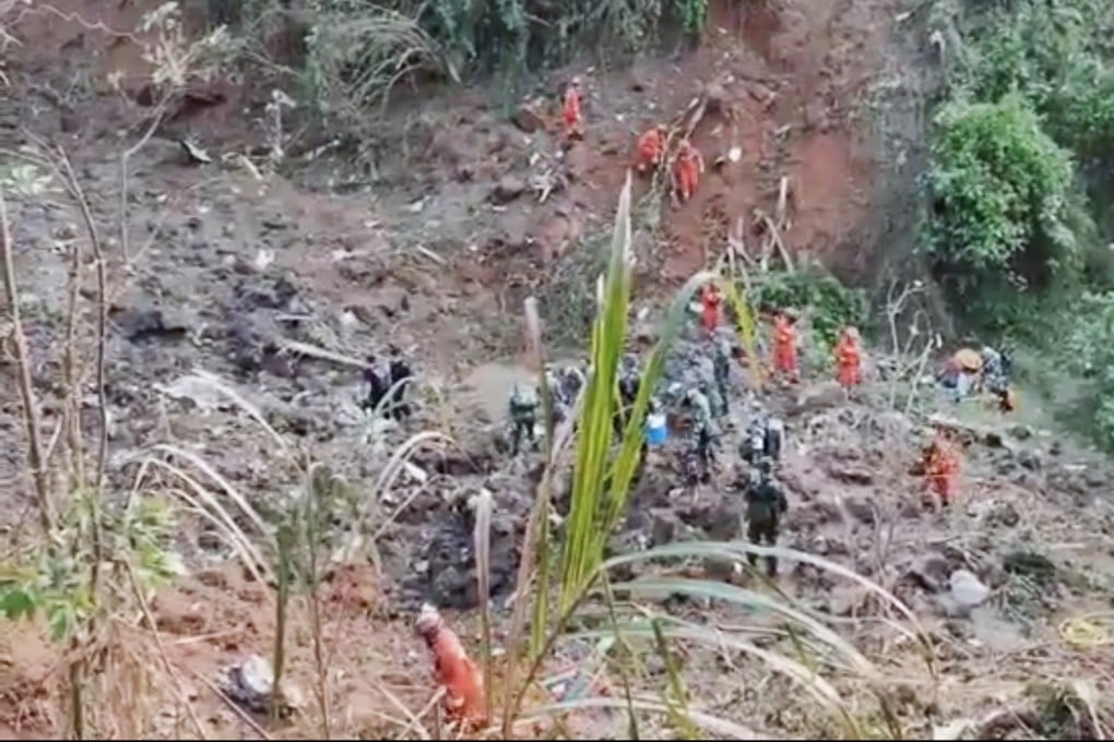 A screen grab from a video clip shows rescuers searching at the China Eastern Airlines crash site in Wuzhou, Guangxi on March 21, 2022. Photo: Captured from CCTV