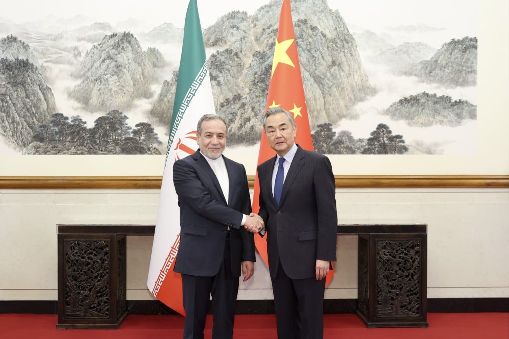 Chinese Foreign Minister Wang Yi (right) with Iranian counterpart Abbas Araghchi in Beijing in April 2025. Photo: Xinhua