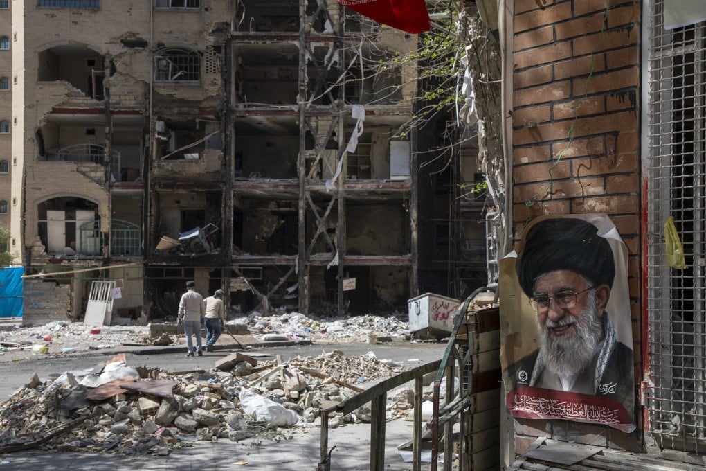 Men clear rubble in front of a damaged residential building that, according to Iranian authorities, was hit by a strike on March 4 during the US-Israeli military campaign. Photo: Getty Images/TNS