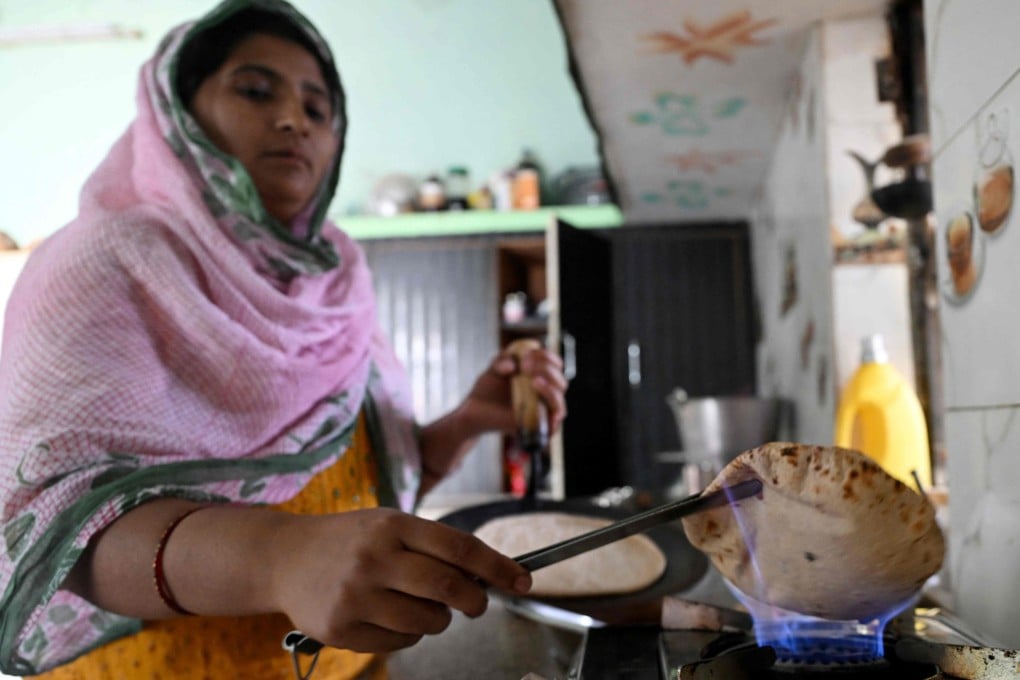 Gauri Devi cooks chapatti using biogas at her home in Uttar Pradesh’s Bulandshahr district on April 24. Photo: AFP