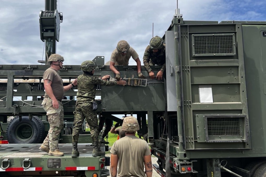 US and Philippine army soldiers fasten the Mid-Range Capability reload fixture to the Typhon system as part of Exercise Salaknib on June 27, 2024. Photo: US Army