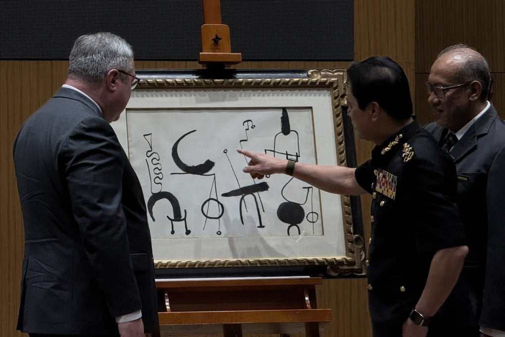 Malaysian Anti-Corruption Commission chief Azam Baki (second from right) inspects Joan Miro’s “Composition” (1953) at the MACC headquarters in Putrajaya on Wednesday. Photo: Iman Muttaqin Yusof
