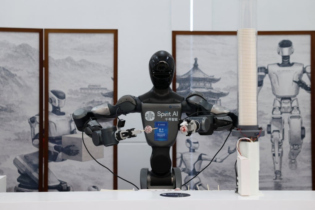 A Moz1 humanoid robot by Spirit AI serves candied fruit skewers at the 2026 Zhongguancun forum in Beijing on March 25. Photo: Reuters