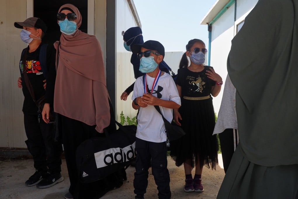 Members of Australian families at Roj camp prepare to leave for Damascus as part of a second repatriation effort by Syrian authorities on April 24. Photo: AP