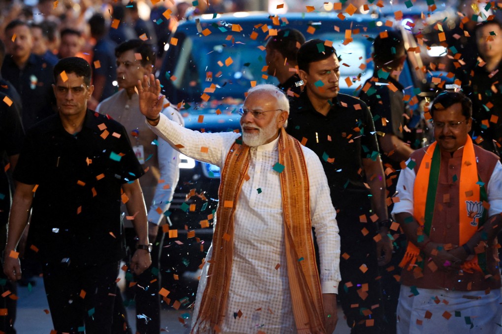 India’s Prime Minister Narendra Modi greets supporters as he arrives at BJP headquarters in New Delhi on Monday to celebrate that day’s election results. Photo: Reuters