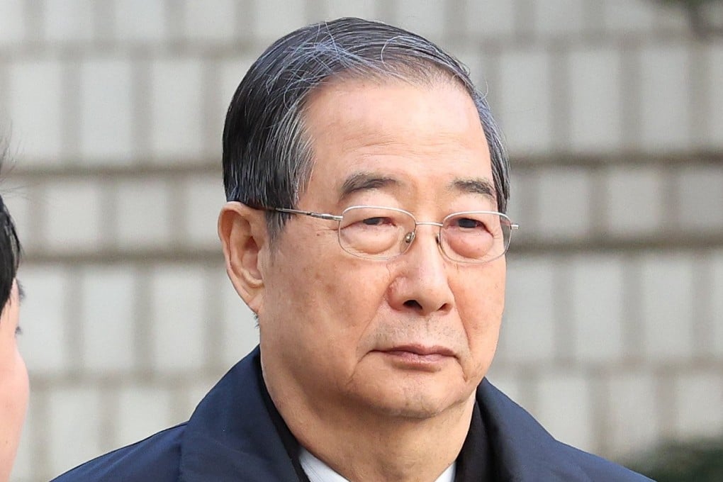 Former South Korean prime minister Han Duck-soo arrives at the Seoul Central District Court on January 21. Photo: EPA