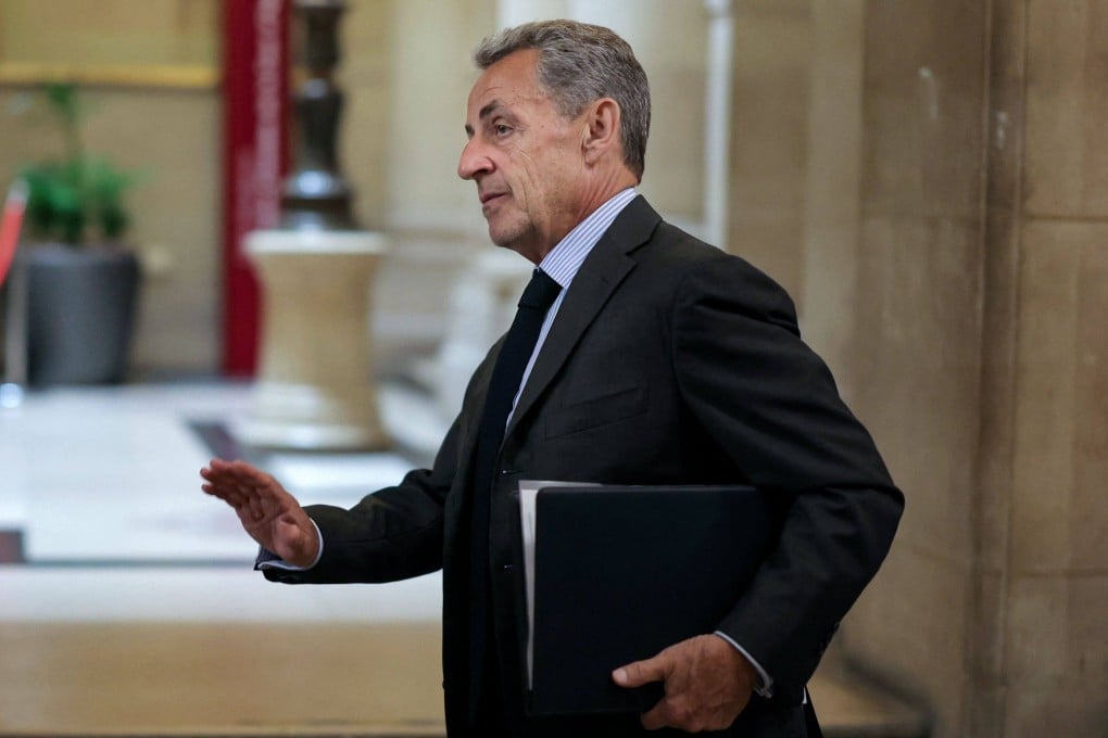 France’s former president Nicolas Sarkozy leaves the courtroom on Wednesday during a break at his appeal trial over charges he had sought Libyan financing for his 2007 election. Photo: AFP