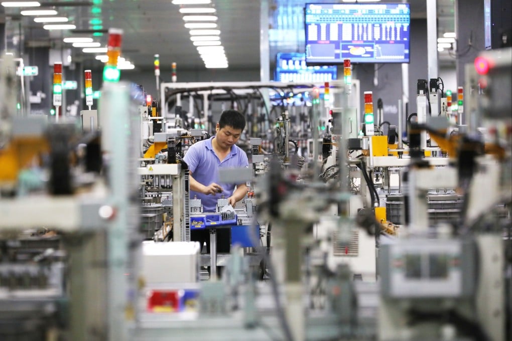 A staff member works at a Midea Group microwave oven factory in Foshan, Guangdong province. Photo: Xinhua