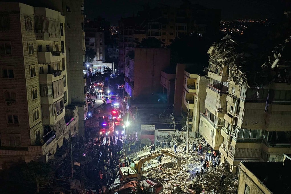 First responders in the Beirut southern suburb of Haret Hreik on Wednesday after an Israeli strike. Photo: AFP