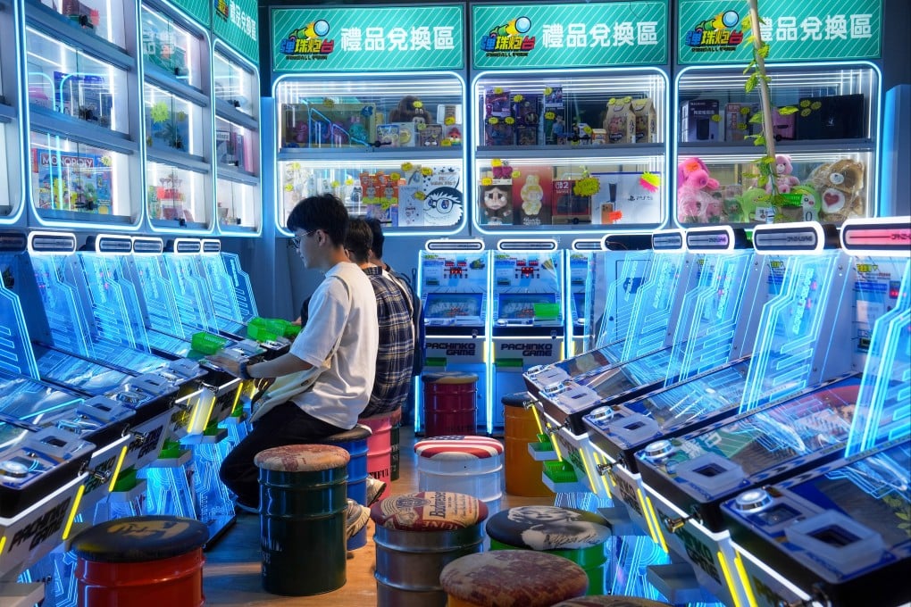 Youngsters play at a pinball arcade in Sham Shui Po. Photo: Elson Li