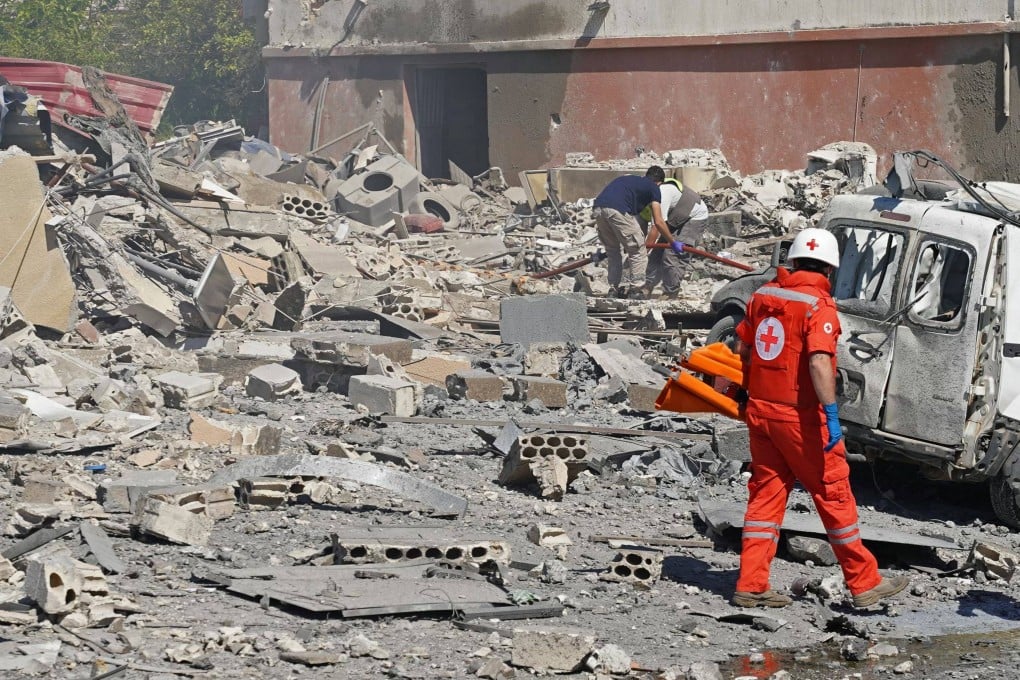 First responders arrive at the site of an Israeli airstrike that targeted the southern Lebanese village of Habbouch on Thursday. Photo: AFP