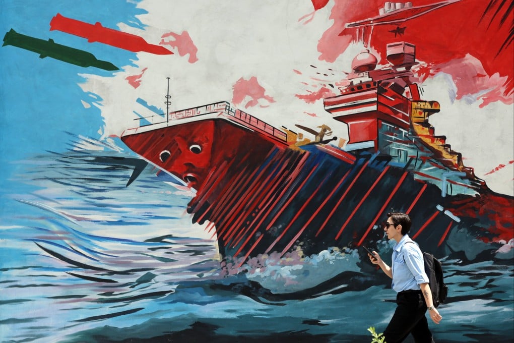 An Iranian walks past an anti-US and Israel mural in a street in Tehran on Friday. Photo: EPA