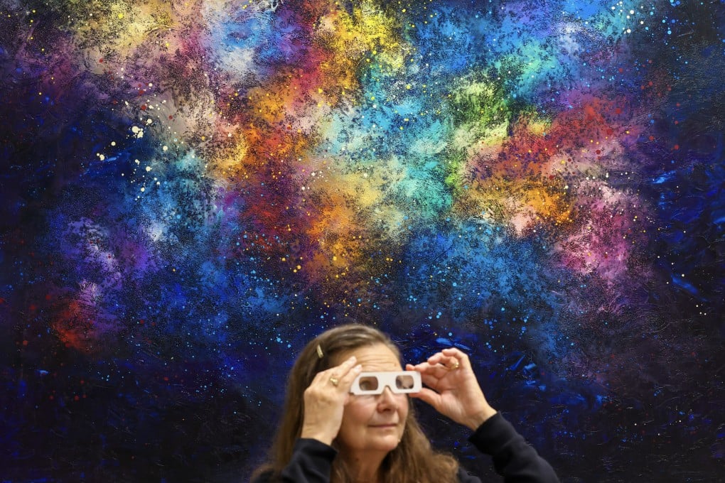 A visitor takes in Kristina Sretkova’s 3D-effect Universal Love at last year’s edition of the Affordable Art Fair Hong Kong Photo: Dickson Lee