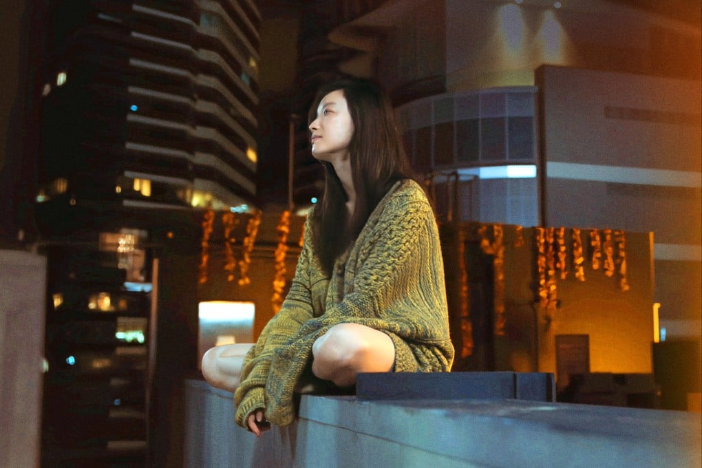 Ni Ni in a still from A Man and a Woman (category IIB, Mandarin, Cantonese, English), directed by Guan Hu. Huang Bo co-stars.
