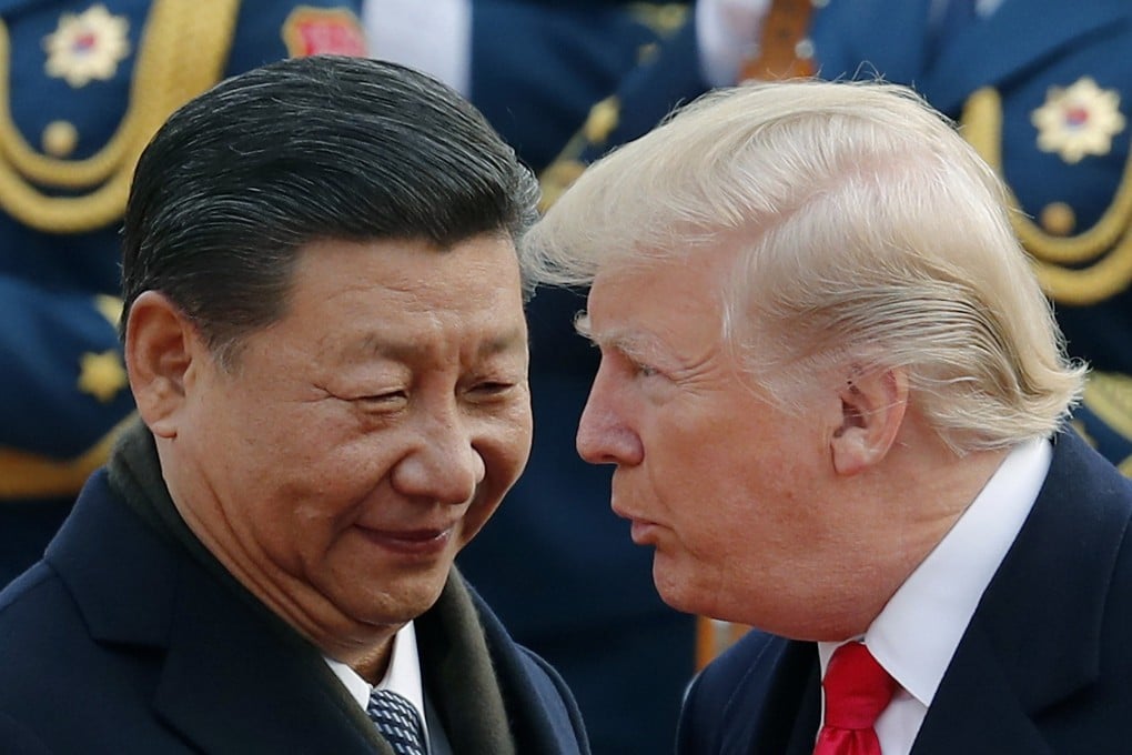 Donald Trump chats with Xi Jinping during a welcome ceremony at the Great Hall of the People in Beijing on November 9, 2017. Photo: AP