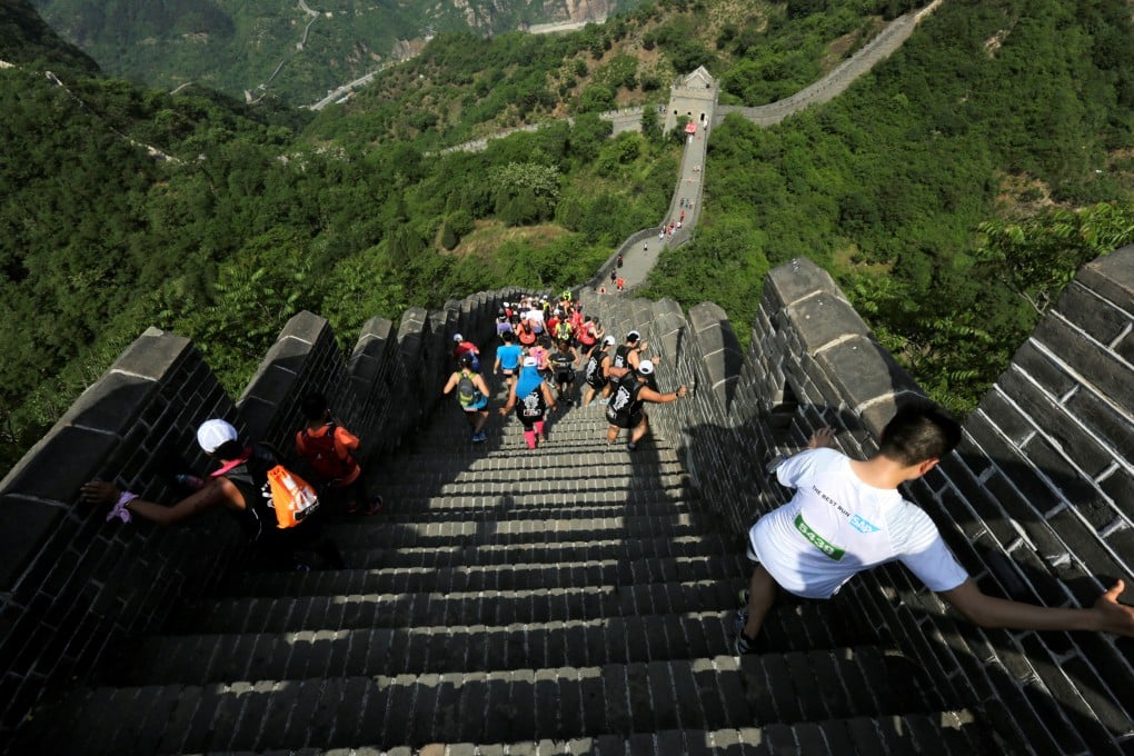 Full-marathon runners will tackle 5,164 steps on the Great Wall, with some slopes said to be as steep as 70 degrees and requiring runners to use their hands to climb. Photo: Reuters