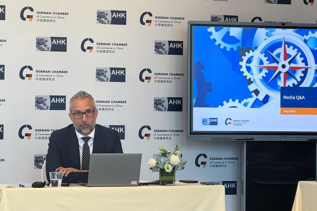 Oliver Oehms, executive director and board member of the German Chamber of Commerce in North China, discusses flash-survey results during a press conference in Beijing on Tuesday afternoon. Photo: Karen Tian
