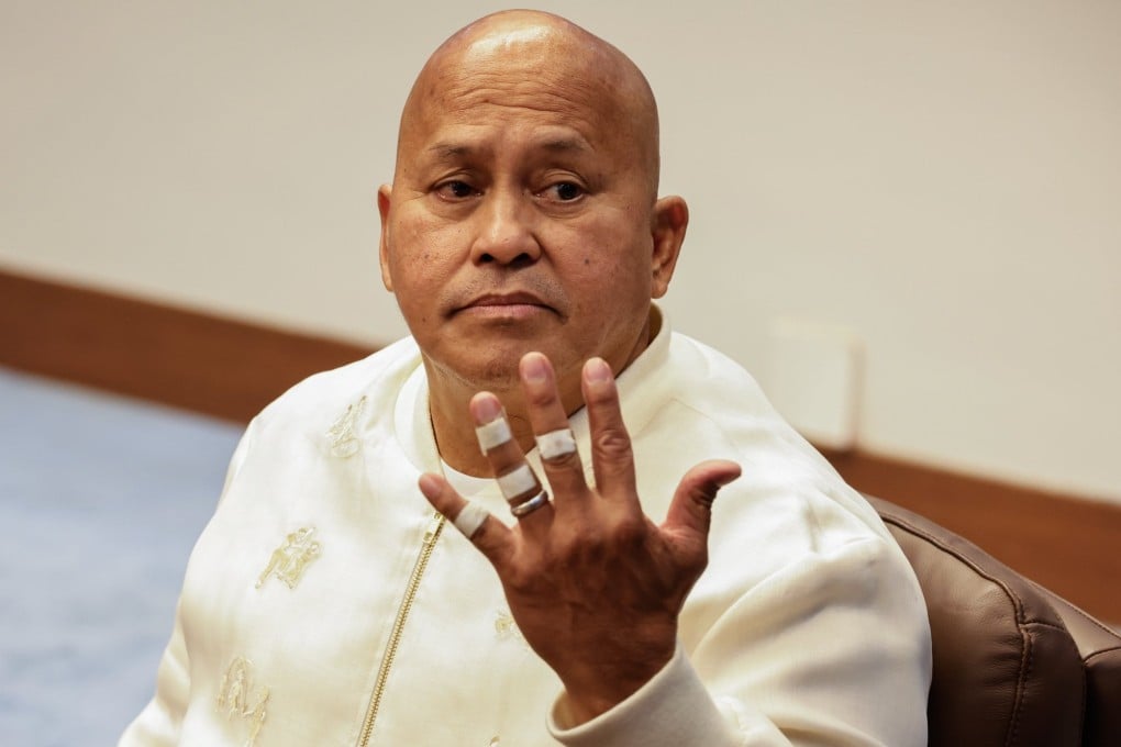 Philippine Senator Ronald dela Rosa shows his bandaged fingers during a session at the Senate in Metro Manila on Tuesday, a day after he evaded an ICC arrest warrant. Photo: EPA