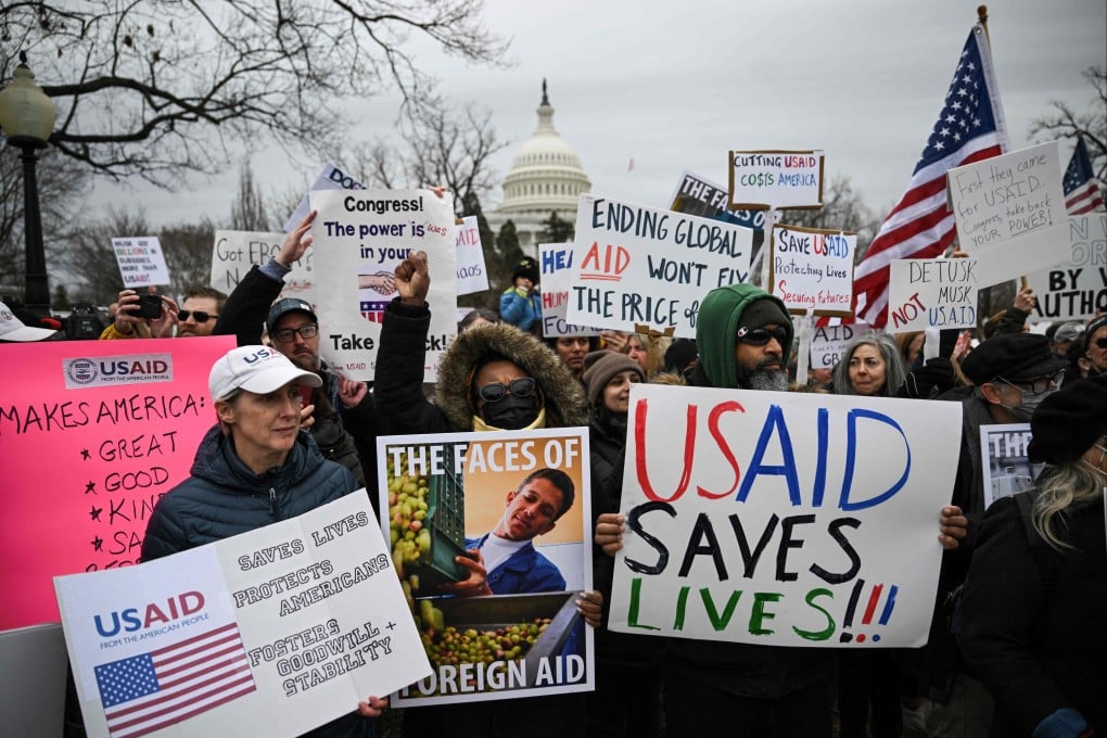 People protest in Washington in February last year against the administration of US President Donald Trump’s decision to virtually shut down the US Agency for International Development (USAID). Photo: AFP