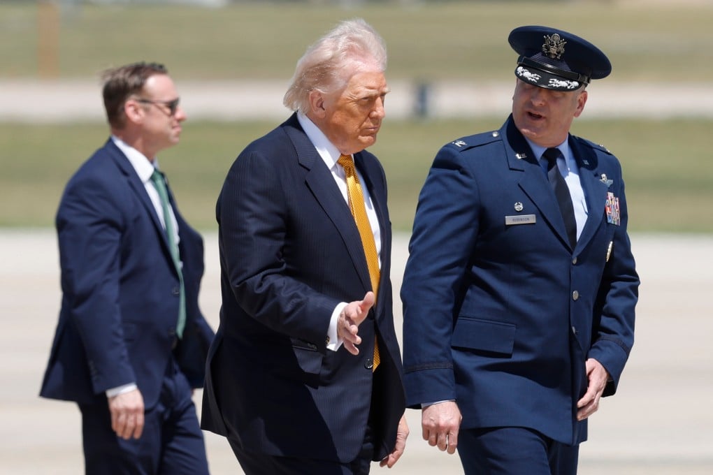 Donald Trump (centre) walks to Air Force One at Joint Base Andrews in Maryland on Tuesday en route to his meeting with Chinese President Xi Jinping. Photo: AP