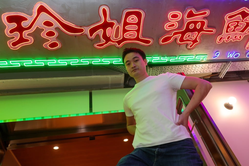 Peter Pang at Big JJ Seafood Hotpot at its new location at Landmark Prince’s in Central, Hong Kong. The original venue’s neon sign (pictured) now lives on the ceiling of the new location. Photo: Edmond So