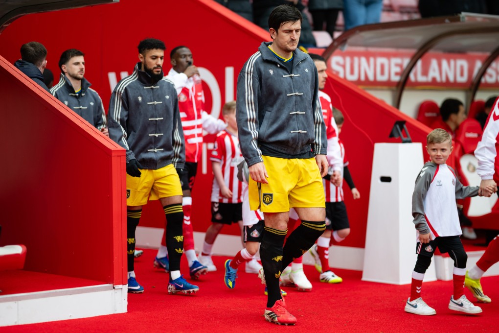 Harry Maguire (right) walks out ahead of his Manchester United teammates in their new tracksuit tops before the Premier League match away to Sunderland on Saturday. Photo: Getty Images