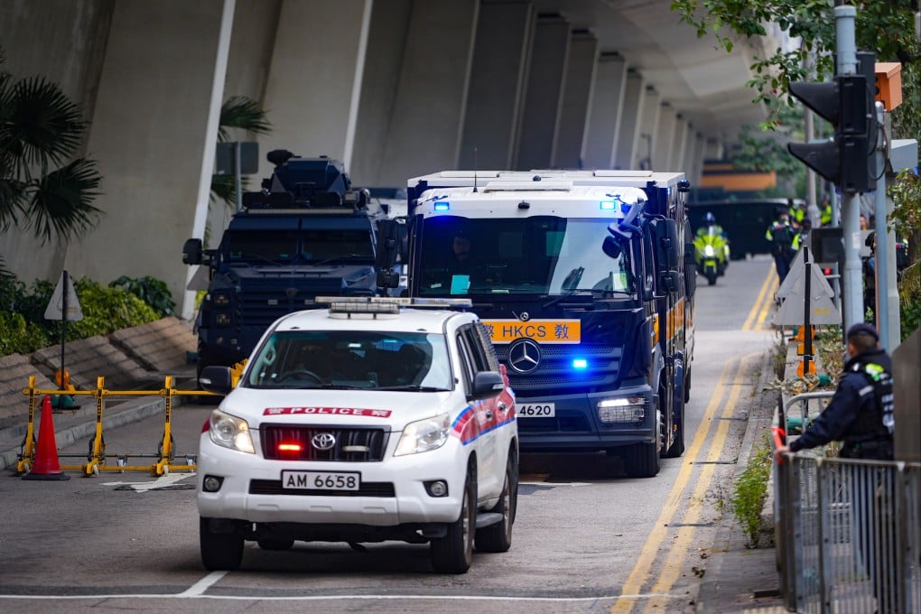 Correctional Services Department vehicles leave the West Kowloon Court where former media boss Jimmy Lai was sentenced to 20 years in prison for violating the national security law, on February 9. Photo: Eugene Lee
