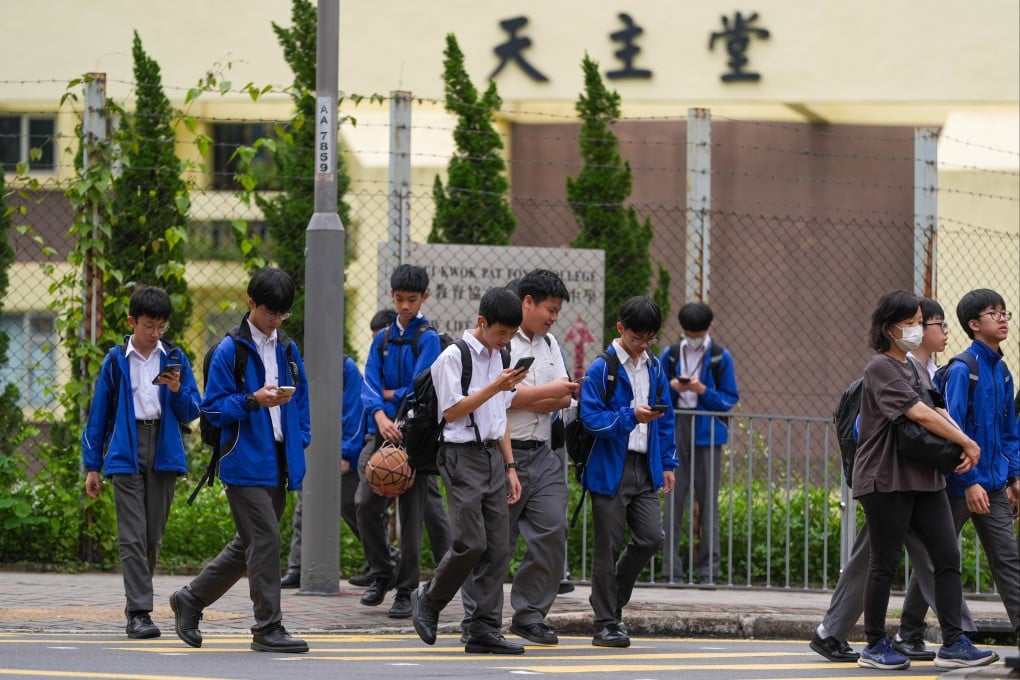 Kwun Tong Maryknoll College students leave the school on May 6. Photo: Eugene Lee