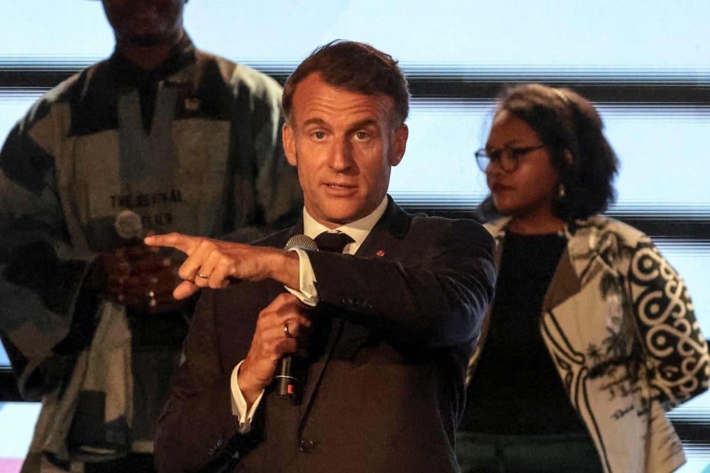 France’s President Emmanuel Macron criticising attendees for talking over the speakers. Photo: AFP