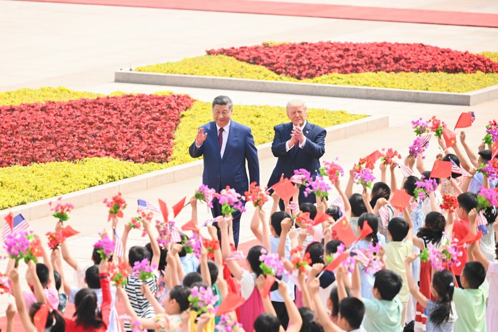 Children greet Chinese President Xi Jinping and Donald Trump at the welcome ceremony for the US president outside the Great Hall of the People prior to their talks in Beijing, China, on May 14. Photo: Xinhua