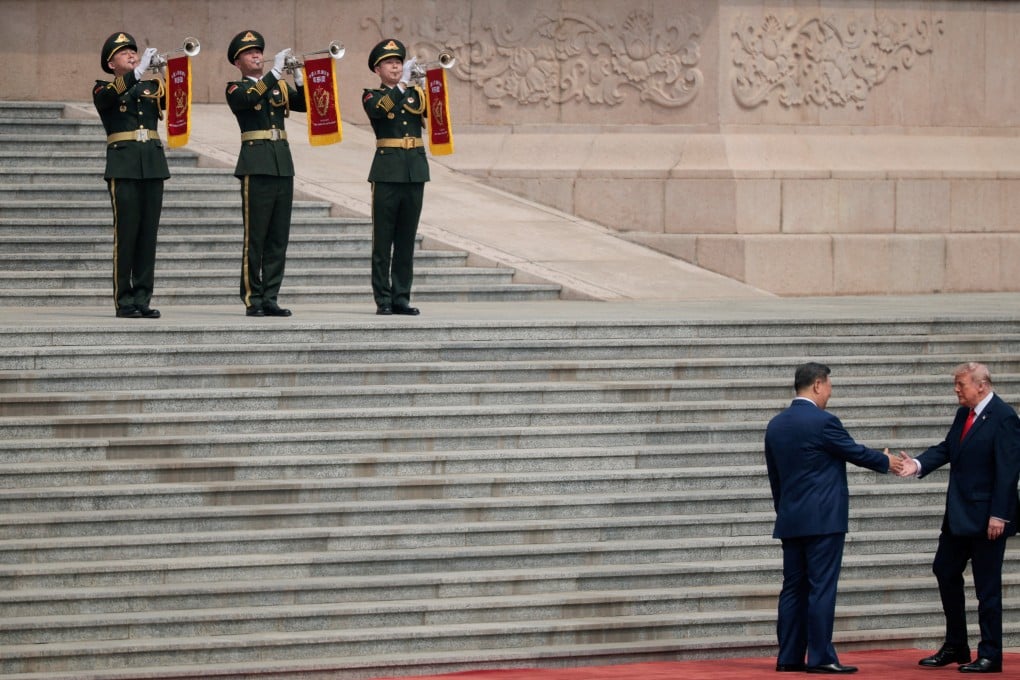 US President Donald Trump (bottom right) shakes hands with Chinese President Xi Jinping upon arriving at the Great Hall of the People in Beijing on May 14. Photo: Reuters
