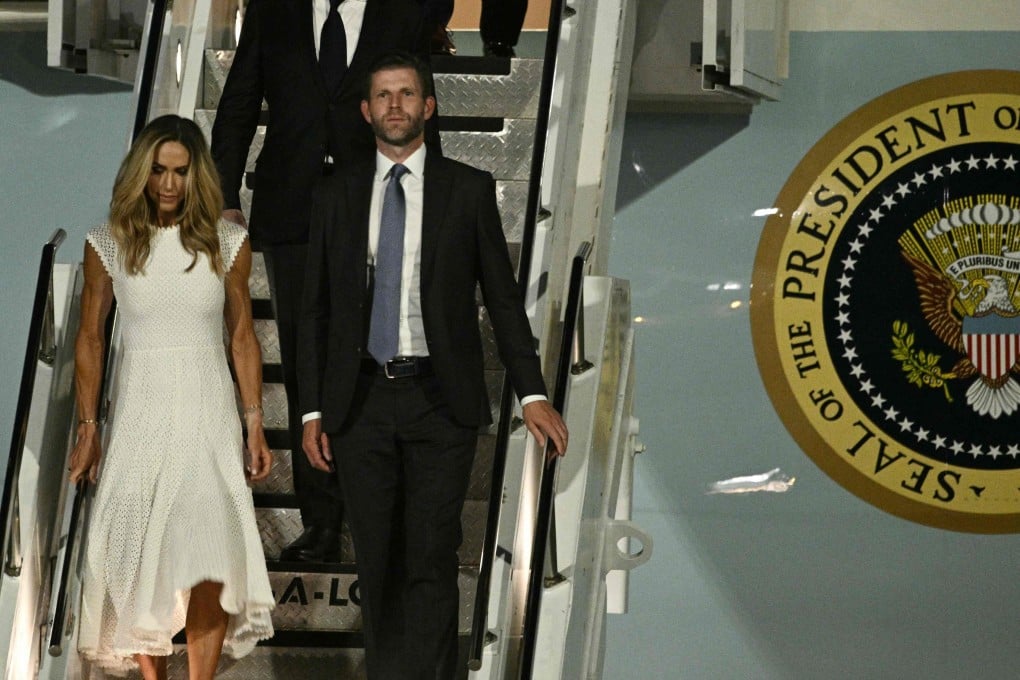 Eric and Lara Trump walk off Air Force One upon arriving at Beijing Capital International  Airport on Wednesday. Photo: AFP