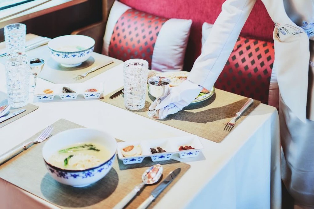 A meal is served aboard the Silk Road Express, a luxury tourist train in China that recently started operating a new route straddling Sichuan and Yunnan provinces. Photo: Courtesy of Train of Glamour
