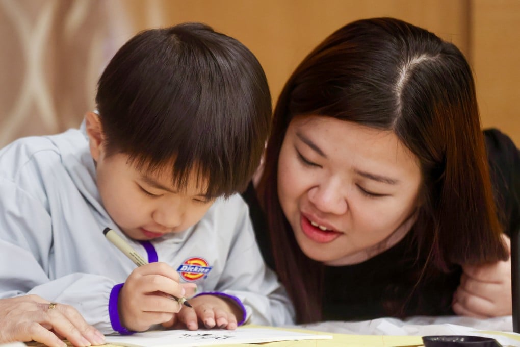 Chau Ting-ting and her son, Ziyi, are among those who have benefited from the programme. Photo: Jonathan Wong