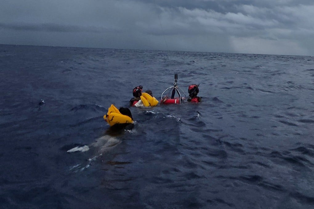 The survivors being hoisted to safety. Photo: US Air Force via AP)