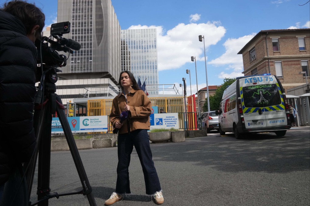 Reporters stand in front of the Bichat Hospital where a woman who tested positive for hantavirus remains in intensive care, in Paris on Tuesday. Photo: AP