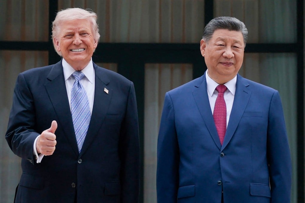 US President Donald Trump poses for photos with President Xi Jinping on Friday in Beijing. Photo: AFP