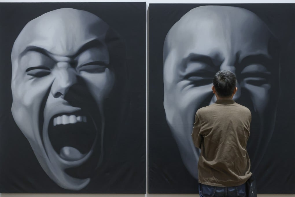 A visitor to the M+ looks at The Second State by Geng Jianyi. Photo: Jonathan Wong